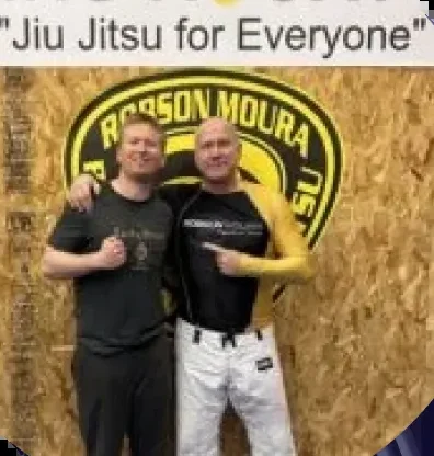 Two martial arts practitioners at a Brazilian jiu-jitsu gym