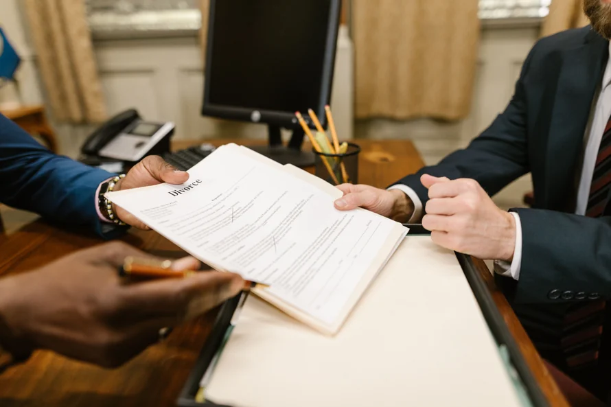 Two people reviewing a document across a desk