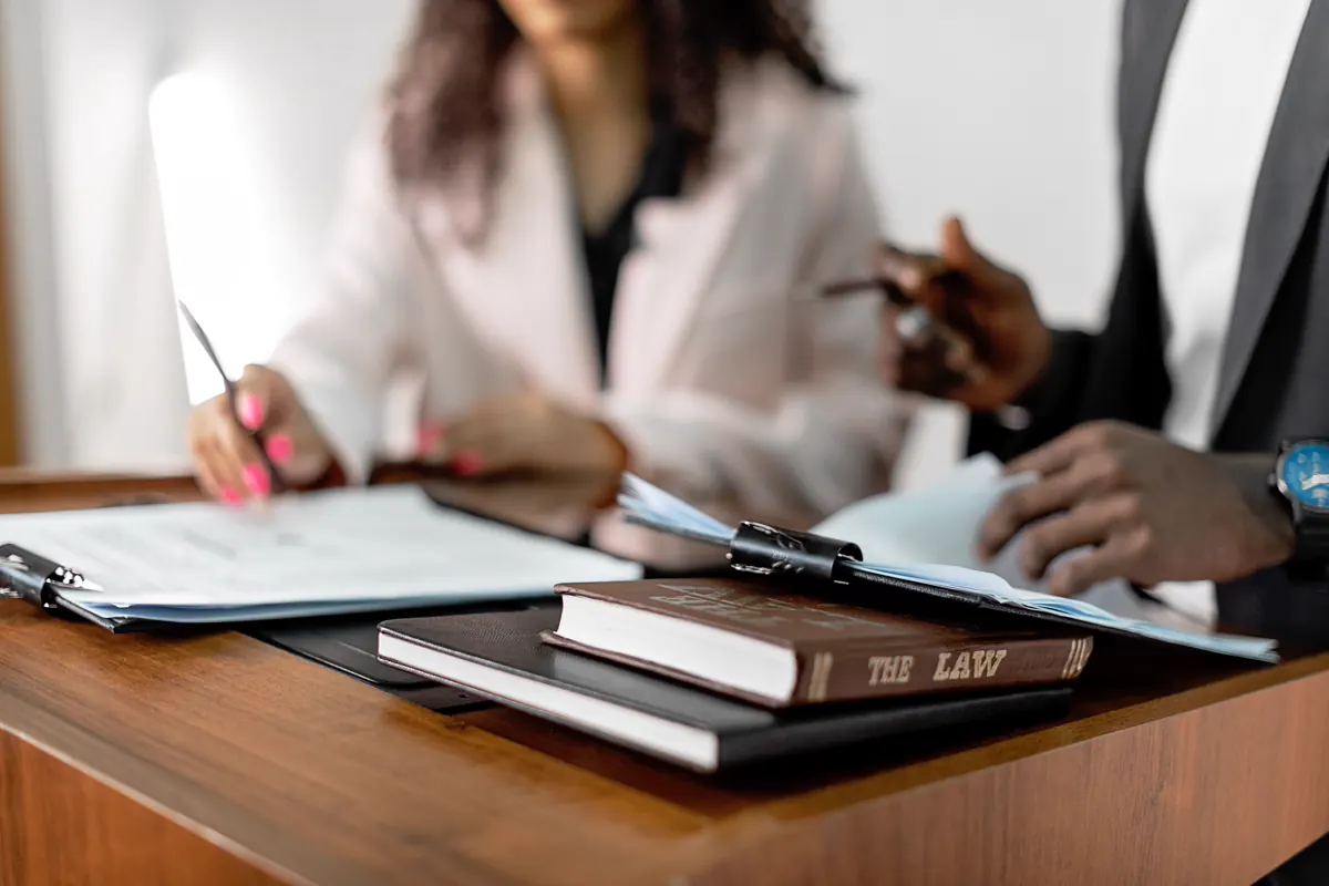 Law books and documents on a desk during a legal review